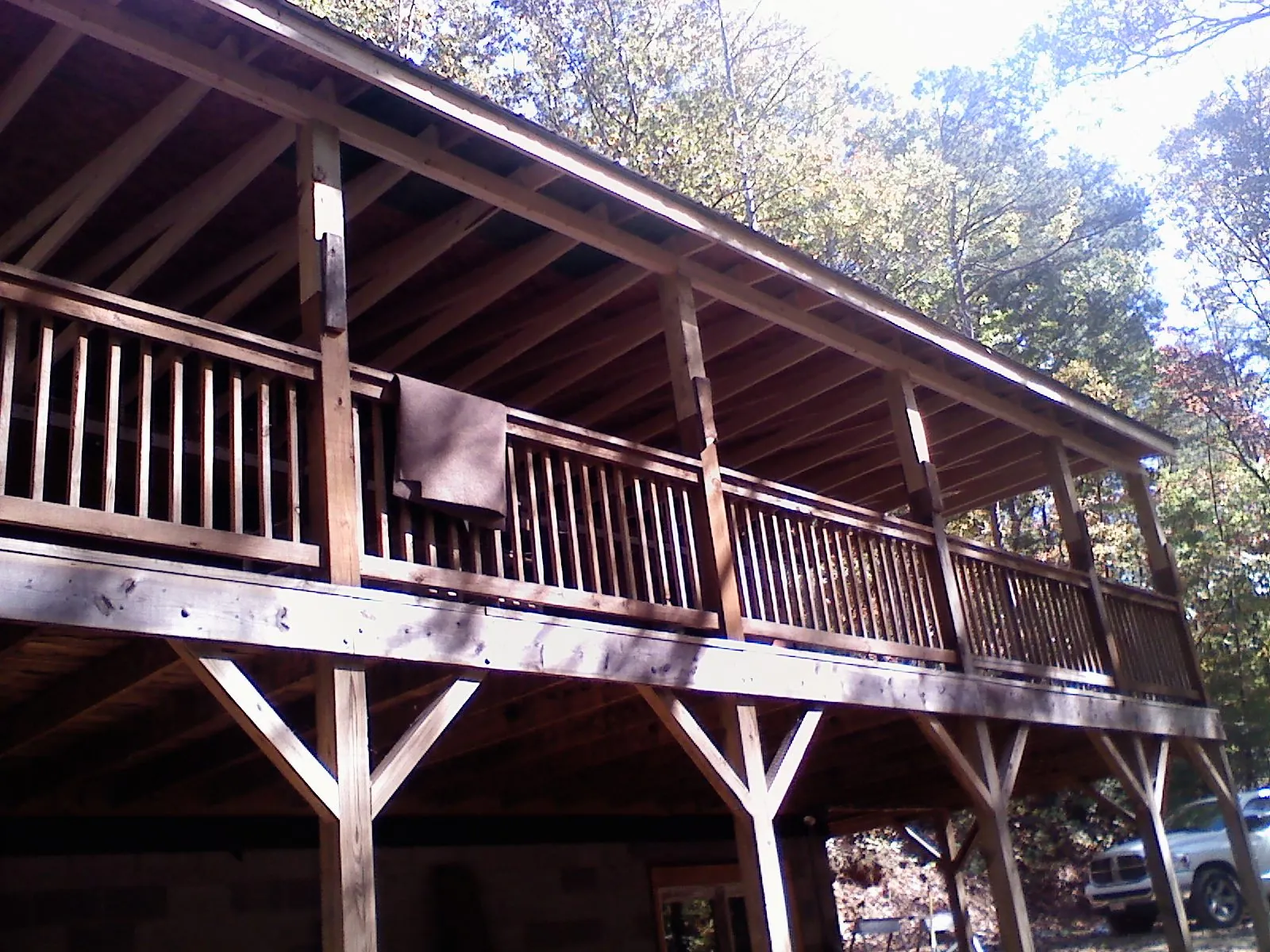 Timber framing under a new elevated porch and deck in Grandville